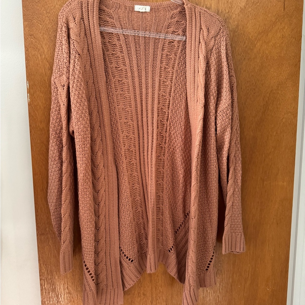Size S cardigan. Orangey-brown color